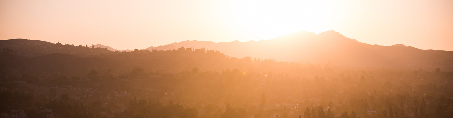 Sunlight over mountains near campus