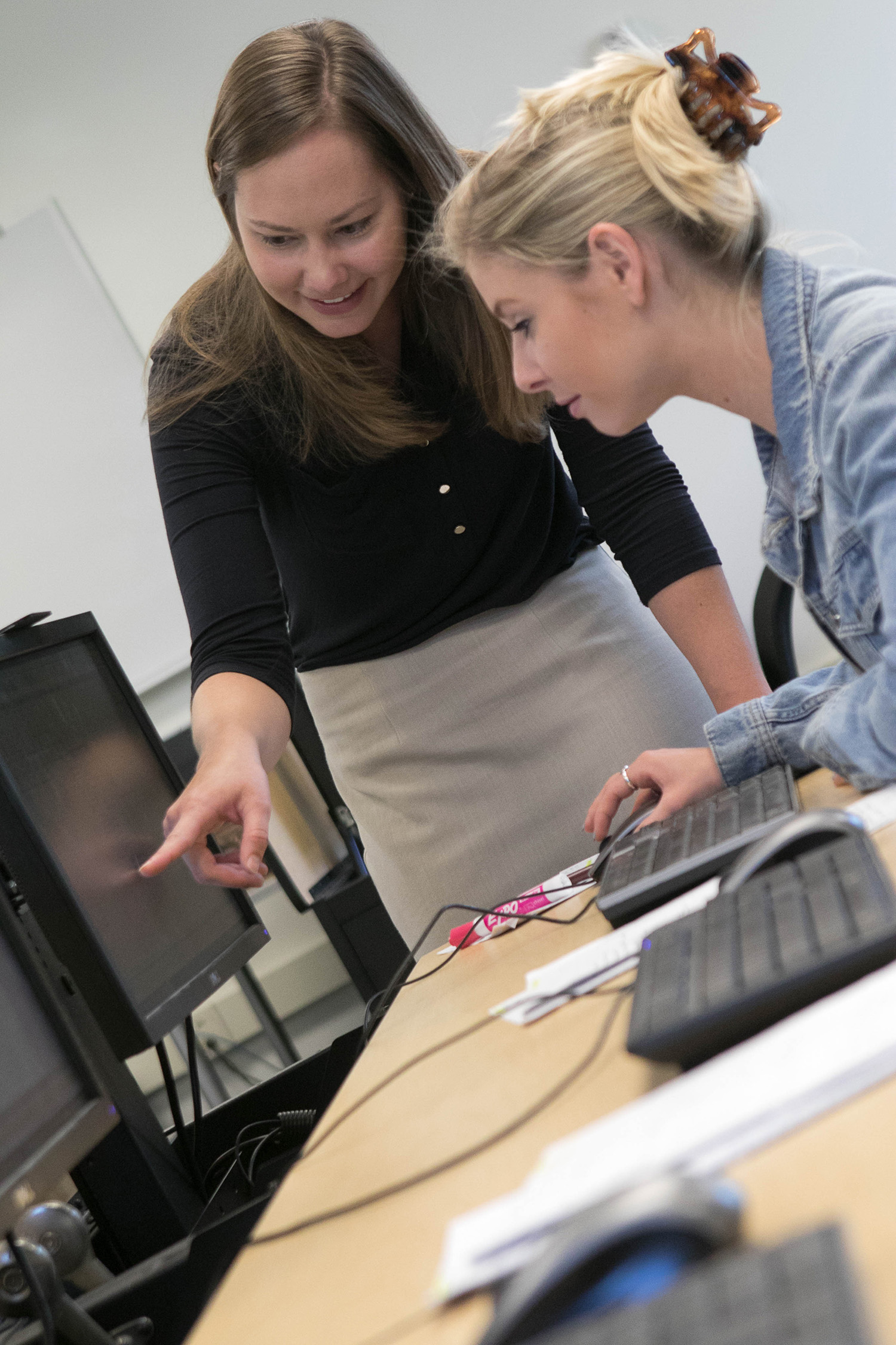 Faculty member helping a student